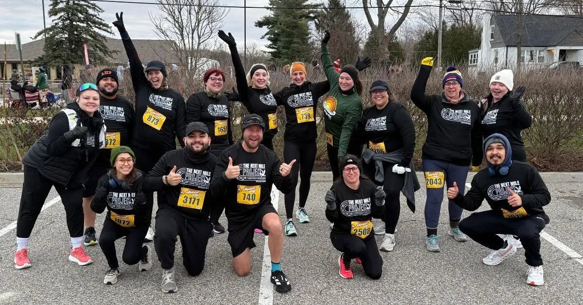 Miles with Misty Turkey Trot training group smiling together on race day